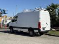 A 2023 Mercedes-Benz Sprinter 2500 van in white with a high roof and roof racks positioned on top