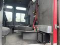 Interior of a 2006 E-One Typhoon fire truck featuring several seats and safety harnesses visible in the foreground