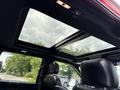 A 2019 Ford F-150 with a panoramic sunroof and leather seats visible in the foreground