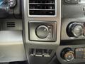 Control panel of a 2020 Ford F-550 showing knobs for drive modes and volume settings