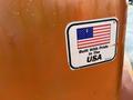 A sticker on a machine displaying the American flag with the text Built With Pride In The USA