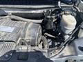 A 2020 Chevrolet Express engine compartment showing the engine block air filter oil reservoir and various engine components
