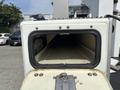 A close-up view of the opening of a 2012 International 7300 Workstar featuring a rectangular frame with a smooth surface and a dark, empty interior