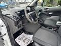 Interior view of a 2019 Ford Transit Connect showcasing the driver's seat dashboard and controls with a thank you mat on the floor