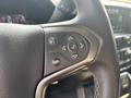 The steering wheel of a 2017 Chevrolet Silverado 1500 featuring control buttons for audio and cruise settings