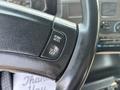 Close-up of a steering wheel with control buttons labeled RSM/ACCL and SET/CST in a 2006 Sterling Acterra vehicle