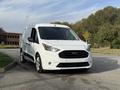 A white 2020 Ford Transit Connect van parked with a front view showcasing its sleek design and distinctive grille