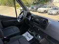 Interior view of a 2019 Mercedes-Benz Sprinter showing the dashboard front seats and steering wheel