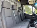 Interior view of a 2019 Mercedes-Benz Sprinter showcasing the front seats and dashboard with a modern design and ergonomic layout