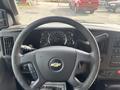Steering wheel of a 2018 Chevrolet Express with dashboard instruments and controls visible