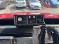 The image shows a SA-500 control panel featuring buttons for yelp, mail, and radio with a power switch and a connected microphone mounted in a vehicle