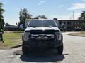 A 2017 Ford F-550 facing the camera with a black front bumper and chrome grille showcasing the Ford logo