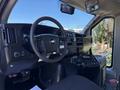 Interior view of a 2013 Chevrolet Express showing the steering wheel dashboard and controls
