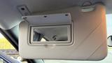 A sun visor with a built-in mirror in a 2019 Nissan Kicks