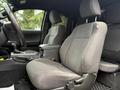 Interior view of a 2016 Toyota Tacoma showing the driver's seat and center console with geometric patterned upholstery