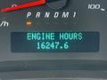 The dashboard display of a 2020 Chevrolet Express showing the text ENGINE HOURS followed by the number 16447.6