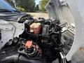 A 2016 Ford F-750 with its hood raised displaying the engine and internal components including the radiator and battery