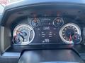 Dashboard of a 2017 RAM 1500 showing gauges for temperature fuel speed and engine info with digital display detailing driving hours and mileage