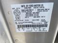 A 2014 Ford F-150 vehicle identification and specification label displaying details like weight ratings and tire sizes