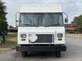 Front view of a 2018 Ford Econoline van with a white exterior and a distinctive grille design