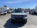 A 2023 Ford Bronco Sport with a bold front grille and distinctive headlights showcasing its rugged design