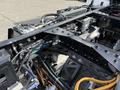 Close-up of the chassis of a 2022 Lion Lion6 electric vehicle showing intricate wiring and mechanical components