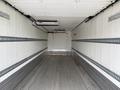 A 2019 Ford F-750 empty truck trailer with a smooth metal floor and gray interior walls featuring horizontal ventilation strips