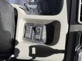 A close-up view of the dashboard controls of a 2010 International 4300 featuring two buttons labeled "PARKD REGEN" and "INHIBIT REGEN"