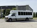 A white 2020 Chevrolet Express with a large windows is parked with its front facing slightly towards the right side