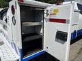 A 2017 Chevrolet Colorado with an open utility bed compartment showing shelves and storage space