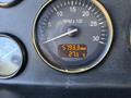 Close-up of a dashboard gauge displaying engine hours at 5793.3 and temperature at 27.5 degrees Celsius in a 2020 Peterbilt 330