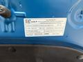 A 2021 Kia Forte vehicle emission control information label with details about compliance and regulations