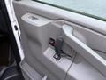 Interior door handle and controls of a 2016 GMC Savana van showing a simple gray design with a door lock mechanism and a pull handle