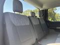 Interior of a 2023 Ford F-350 SD showing the backseat with gray fabric upholstery and headrests