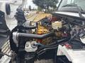 A 2006 Freightliner M2 106 with its hood open showcasing a detailed view of the engine compartment including various hoses and components