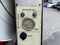 Control panel for a water pump featuring an RPM gauge a power switch and labels for water pressure and a 12-volt DC outlet