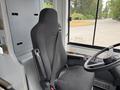 Interior of a 2018 Grande West Vicinity bus featuring a black driver's seat with a seatbelt and controls on the dashboard in front