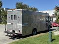 A silver 2009 Morgan Olson Workhorse W62 delivery vehicle with side and rear doors and various compartments visible
