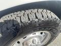 Close-up of a tire on a 2012 RAM 2500 showing deep treads and the Goodyear branding on the sidewall