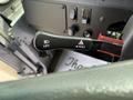 A close-up of the gear shift lever in a 2020 Freightliner MT45 with labels for lift and pull functions