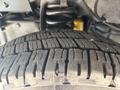 Close-up view of a tire from a 2018 Ford Econoline showcasing detailed tread pattern and texture