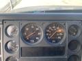 Dashboard of a 1997 Freightliner FL70 showing various gauges for oil pressure RPM speed fuel water temperature and odometer