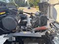 Detailed view of the engine compartment of a 2012 Hino 338 truck showcasing various mechanical components and tubing