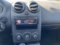 The interior dashboard of a 2006 Pontiac G6 featuring air vents a car stereo system and climate control knobs