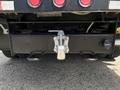 A 2017 Ford F-550 with a hitch at the rear featuring two towing hooks and a connector for accessories