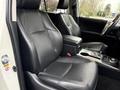 Front leather seats of a 2018 Toyota 4Runner featuring a center console and gear shift between the seats