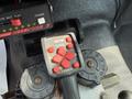 Control panel with buttons for raising and lowering a snowplow featuring labels and a display for power and functions