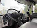 Interior view of a 2012 International TerraStar truck highlighting the steering wheel dashboard and gear shift lever