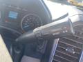 Close-up of the gear selector lever in a 2017 Ford F-150 featuring buttons for tow/haul and sport modes