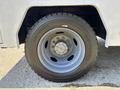 A wheel of a 2017 Ford F-550 featuring a silver rim and a Michelin tire with the size 24570185